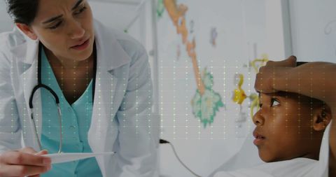 Doctor with Stethoscope Consults Young Boy in Hospital Room