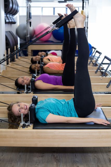 Group of women exercising on reformer - Download Free Stock Photos Pikwizard.com