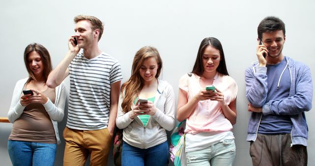 Group of Young Adults on Mobile Phones - Download Free Stock Images Pikwizard.com