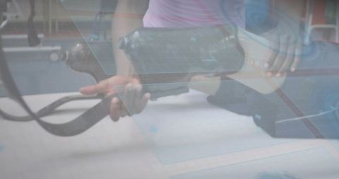Rehabilitation team handling prosthetic socket and straps during collaborative clinic therapy