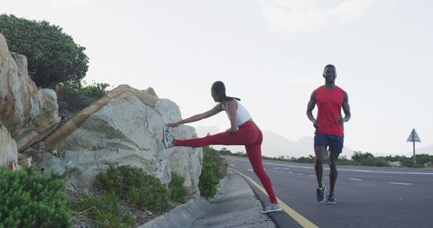 Fit Couple Exercising on Scenic Country Road