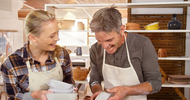 Happy Couple Washing Dishes Together in Pottery Studio - Download Free Stock Images Pikwizard.com