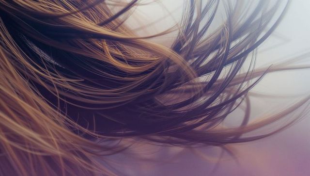 Flowing light brown hair in soft pastel colors