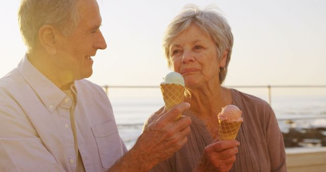 Senior Couple Enjoying Ice Cream Together at the Beach - Download Free Stock Images Pikwizard.com