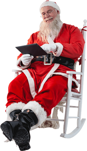 Santa Claus is sitting in a relaxed posture while engaging with technology using a digital tablet. His iconic red costume adds a lively touch, capturing a blend of traditional and modern. Ideal for holiday ads showcasing festive cheer and tech-savvy Santa, perfect for winter promotions or Christmas-themed marketing material.