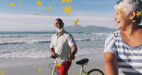 Joyful Seniors Cycling Along Beach with Starry Overlay