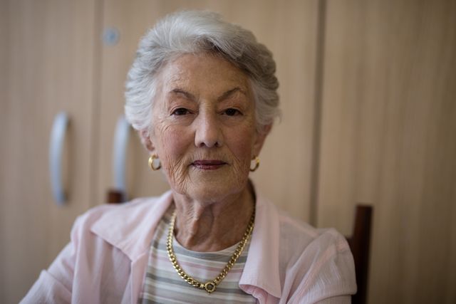 Senior Woman Sitting in Nursing Home - Download Free Stock Photos Pikwizard.com
