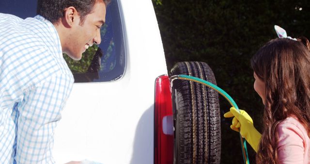 Father and Daughter Smiling While Washing Car on a Sunny Day - Download Free Stock Images Pikwizard.com