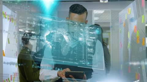 Diverse Business People Analyzing Digital Data on Tablet