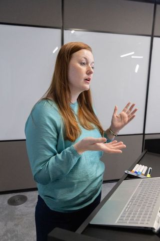 Businesswoman Presenting in Modern Conference Room