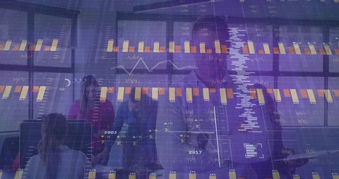 Business team analyzing dashboards with transparent analytics overlay in modern office