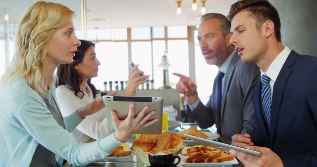 Business People Having Intense Discussion During Breakfast Meeting - Download Free Stock Images Pikwizard.com