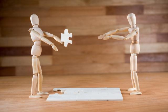 Wooden Mannequins Solving Puzzle Together - Download Free Stock Photos Pikwizard.com