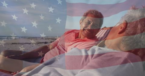 Senior Couple Relaxing at Beach under American Flag Overlay