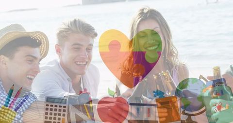 Friends Relaxing at Beach Party Celebrating Autism Awareness