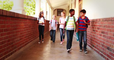 Diverse Group of Schoolchildren Walking Indoors - Download Free Stock Images Pikwizard.com