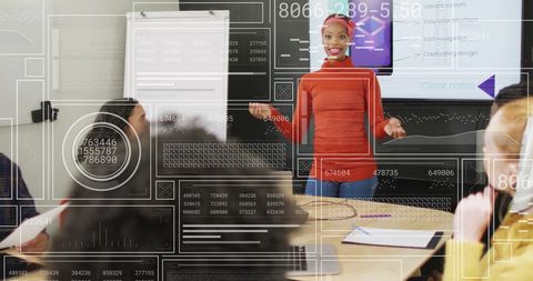 Businesswoman Presenting Data Analytics Concepts to Team in Meeting