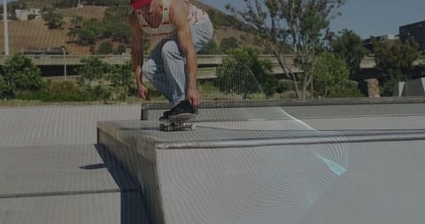 Skateboarder Balancing on Ledge at Skatepark in Active Urban Scene