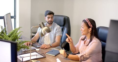 Interacting Colleagues Collaborating in Modern Workspace