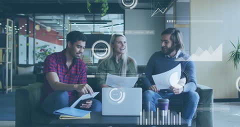 Diverse Colleagues Discussing Documents Amidst Digital Data Graphics