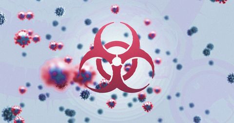 Virus cells surrounding biohazard symbol illustrating health risks