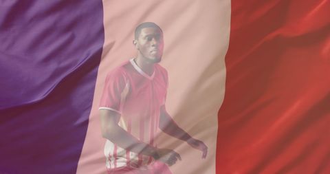 African american soccer player against french flag backdrop