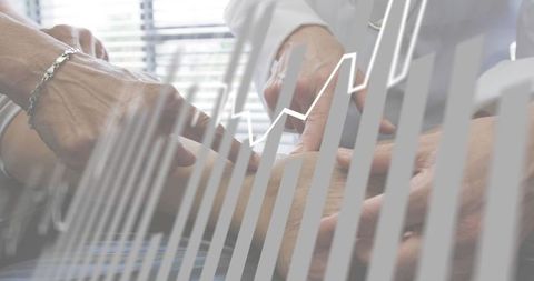 Doctor examining patient wrist and measuring pulse with healthcare data chart overlay
