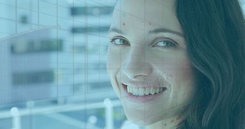 Smiling Businesswoman with Financial Charts Overlay