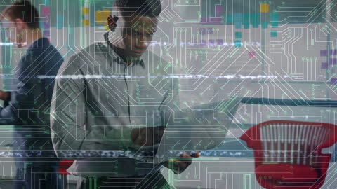 Digital Interface Overlay on Businessman Using Laptop