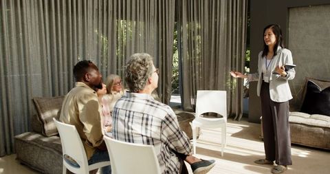 Group therapy session with engaged diverse participants