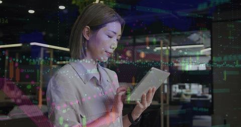 asian businesswoman analyzing financial data on tablet - Download Free Stock Images Pikwizard.com