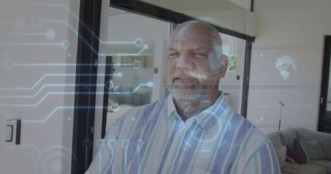 Mature Man Experiences Futuristic Digital Home Interface