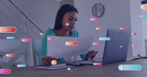 Woman Analyzing Charts on Laptop with Data Overlays