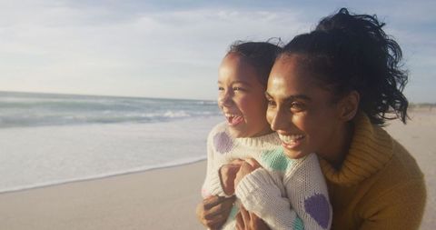 Joyful Mother Daughter Moment on Sunny Beachside