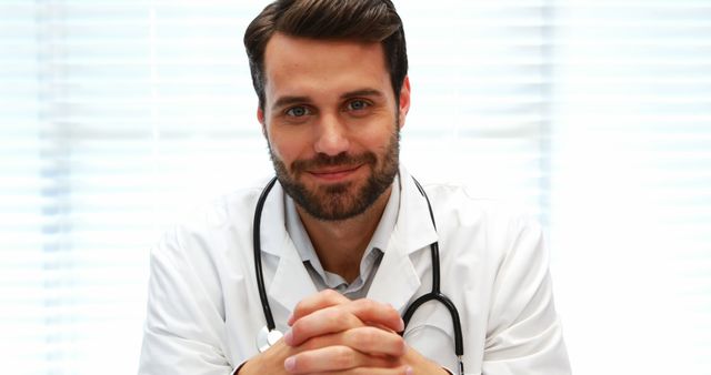 Confident Male Doctor Wearing Lab Coat and Stethoscope Smiling - Download Free Stock Images Pikwizard.com