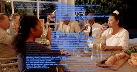 Multigenerational adults enjoying elegant poolside dinner party with digital code projection