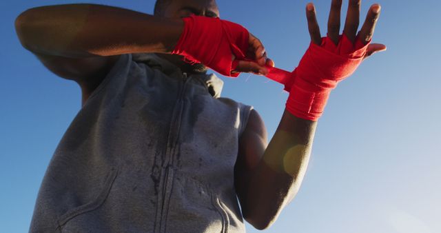 Boxer Wrapping Hands Outdoors Preparing for Training - Download Free Stock Images Pikwizard.com