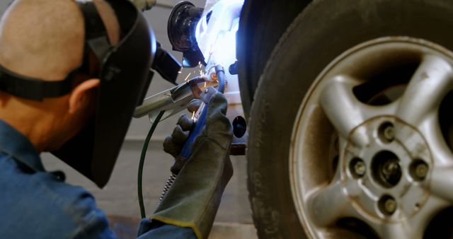 Auto Mechanic Welding Car Frame for Repairs - Download Free Stock Images Pikwizard.com