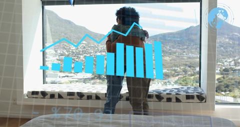 Father and son embracing at panoramic window with financial growth chart overlay