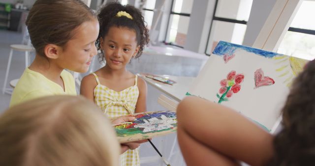 Image of happy diverse girls painting during art lessons at school - Download Free Stock Photos Pikwizard.com