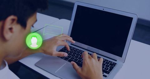 Teenage male typing on laptop with green chat notification and messaging overlay