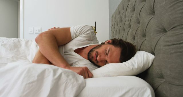 Young Man Sleeping Peacefully in Modern Bedroom - Download Free Stock Images Pikwizard.com