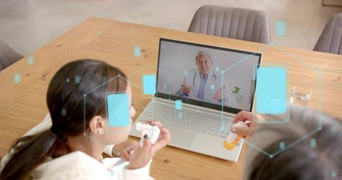 Mother and Teen Holding Pill Bottle While Consulting Doctor on Laptop for Telemedicine
