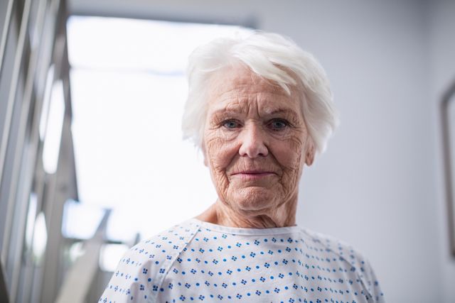 Portrait of smiling senior woman in hospital