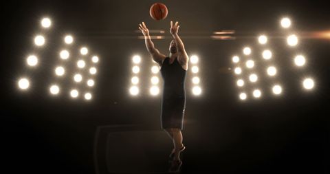 Athlete Shooting Basketball Under Stadium Lights - Download Free Stock Images Pikwizard.com