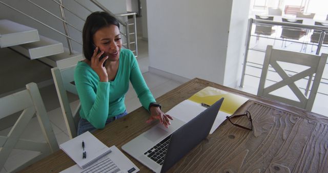 Businesswoman Working from Home and Talking on Phone - Download Free Stock Images Pikwizard.com