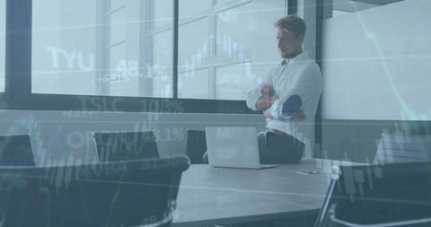 Businessman Analyzing Financial Data Patterns on Laptop