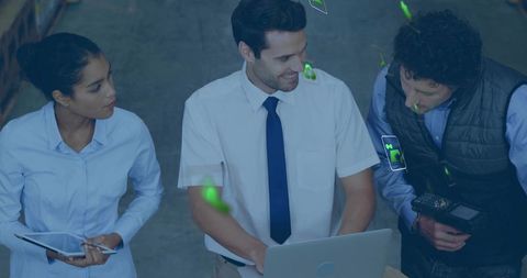 Warehouse team reviewing inventory using ar scanning, laptop and tablet improving logistics