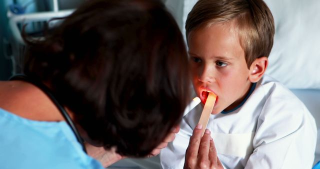 Doctor Examining Child's Throat with Medical Tools - Download Free Stock Images Pikwizard.com