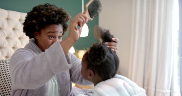 Mother Brushing Daughter's Hair with Care in Cozy Bedroom - Download Free Stock Images Pikwizard.com